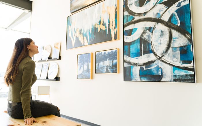 Side,view,of,a,beautiful,young,woman,studying,and,watching