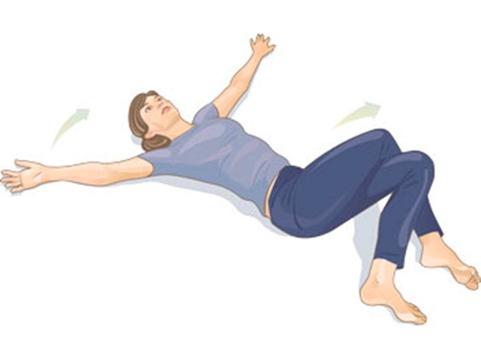 Mal de dos: torsion vertébrale en position couchée (jambes croisées).