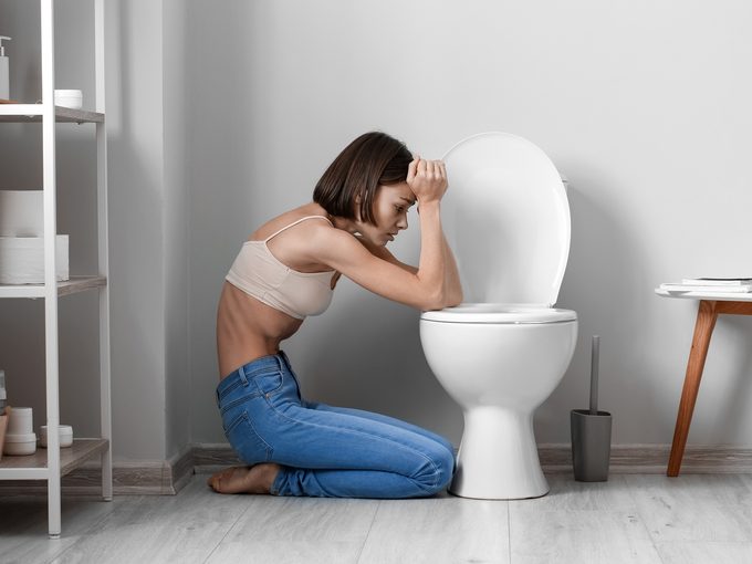 Young,woman,near,toilet,bowl,in,bathroom.,anorexia,concept