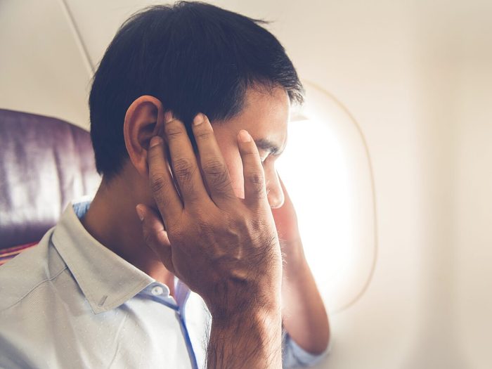 Male Passenger Having Ear Pop On The Airplane