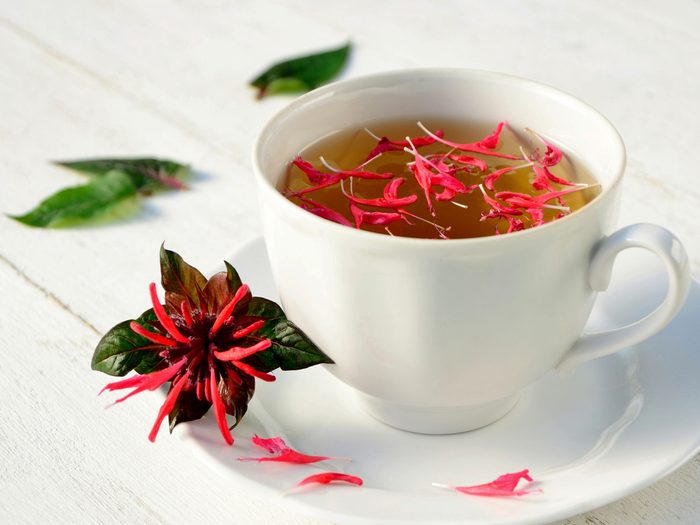 A,cup,of,wonderful,fragrant,tea,with,leaves,and,flowers
