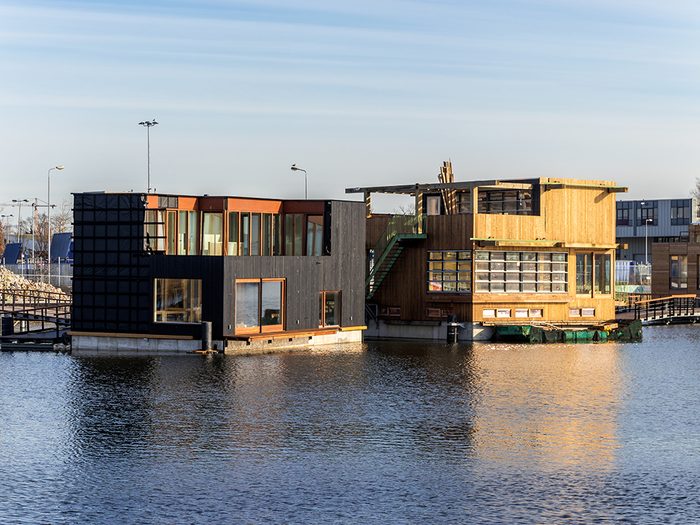 Amsterdam,,january,2019.,two,floating,wooden,houses,with,concrete,base,