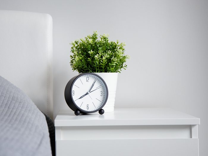 Good,morning,concept, ,modern,alarm,clock,and,houseplant,on
