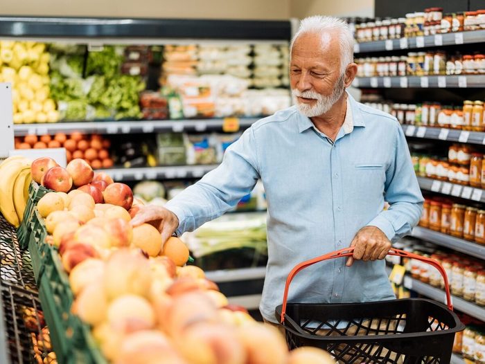 Retired Man Buying Groceries Fruits And Vegetables