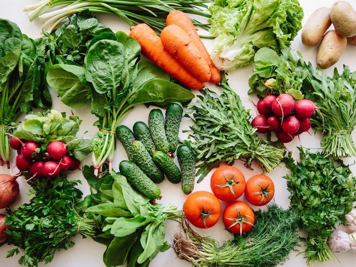 Fresh Greens And Vegetables On A Table, High Angle View