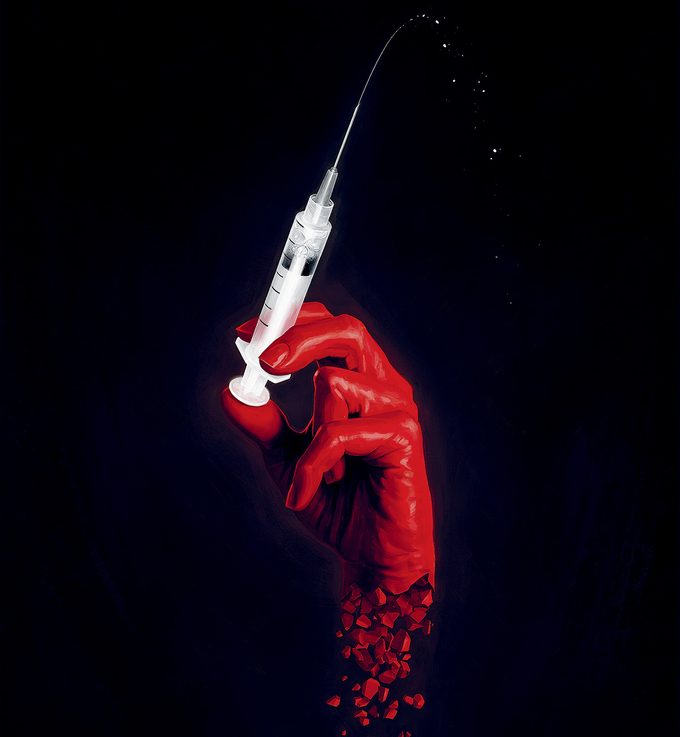 Image d'une main rouge avec une seringue