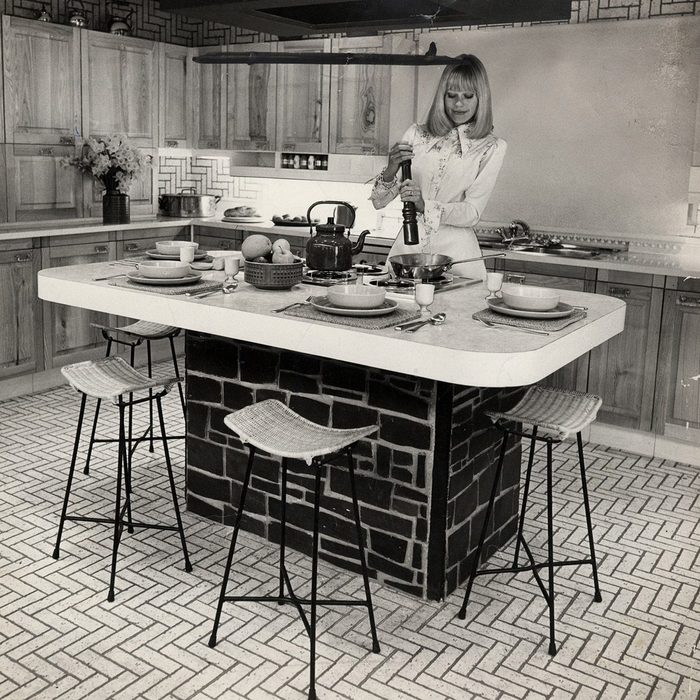 Ideal Home Exhibition 1974. Picture Shows A Woman Cooking In A Kitchen On Show At The Exhibition.