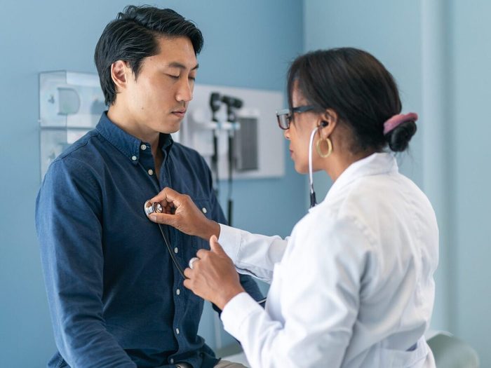 Korean Man In Consultation With Doctor