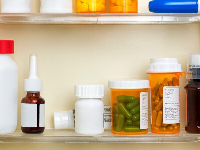 Medications On The Shelves Of A Medicine Cabinet