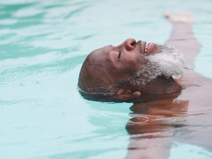 A Mature Man Relaxes In A Pool