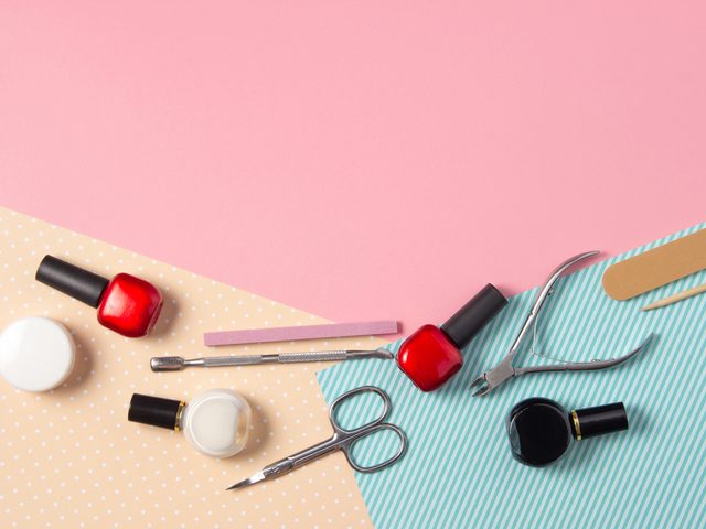 Tools,for,manicure,on,a,pink,and,blue,background.,nail