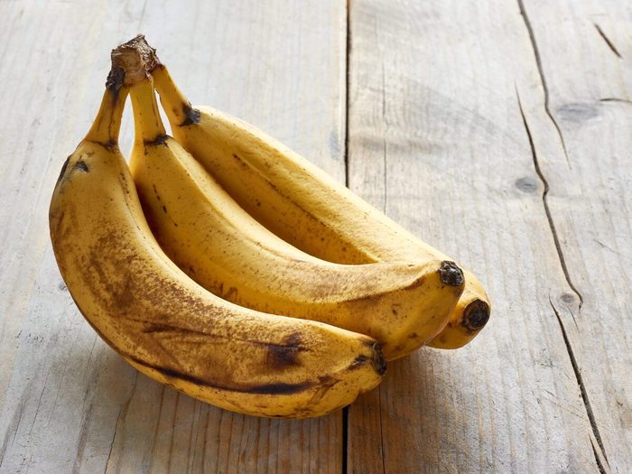 Overripe Bananas On Wooden Table
