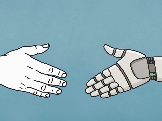 Human And Robot Shaking Hands