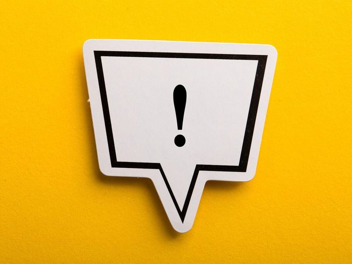 Exclamation Mark Speech Bubble Isolated On Yellow