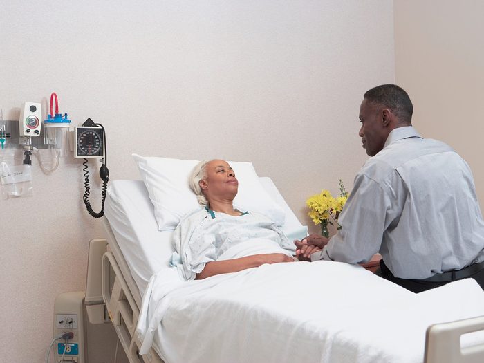 African Man Visiting Mother In Hospital